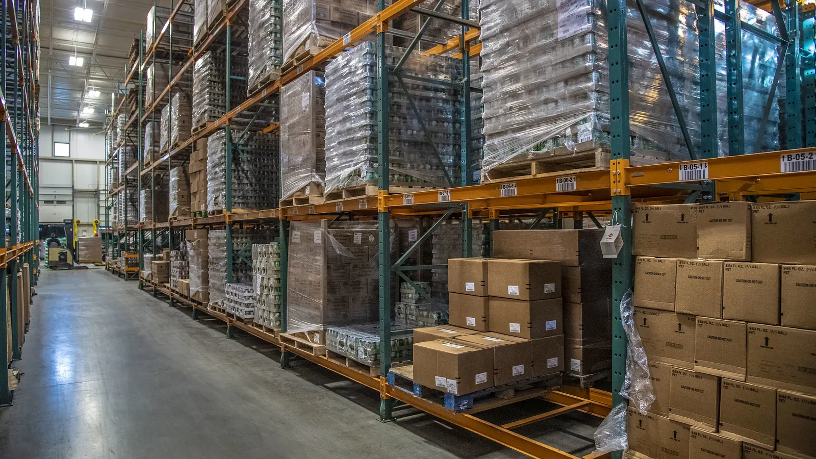 Warehouse aisle with pallet racking holding cartons of stock